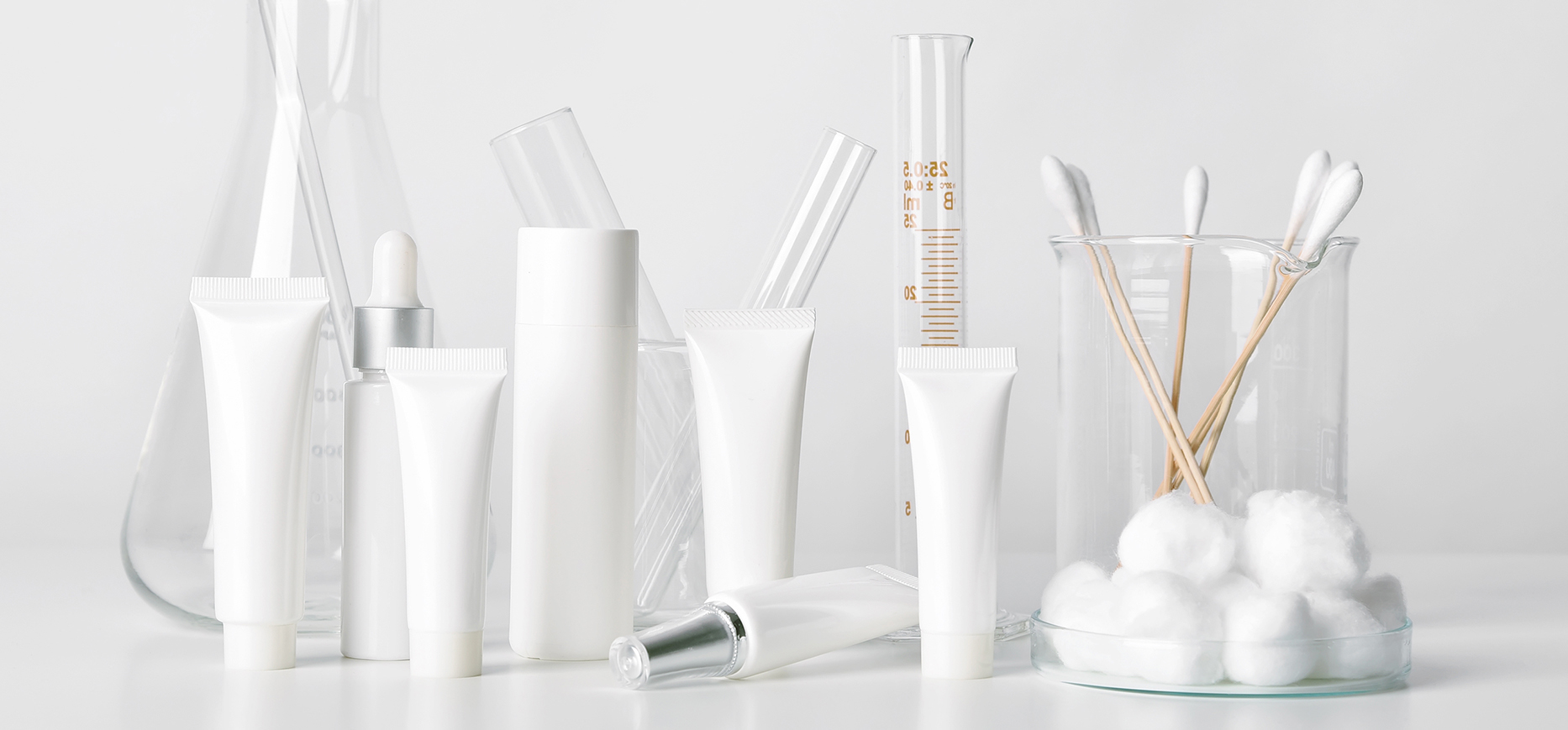Various blank white and glass tubes, cosmetic bottles and scientific equipment. All items are clean and sanitized.
